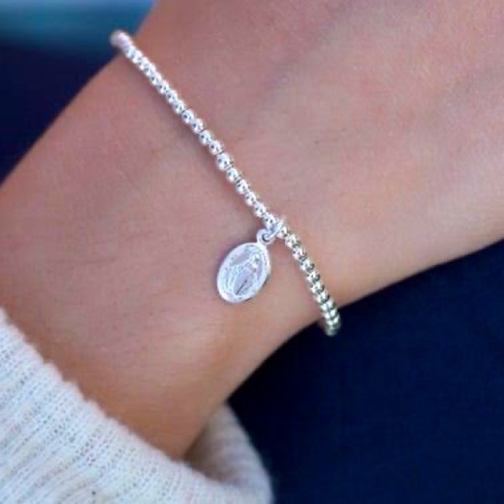 Sterling silver 3 mm stretch Beaded bracelet with a Madonna charm. Custom size